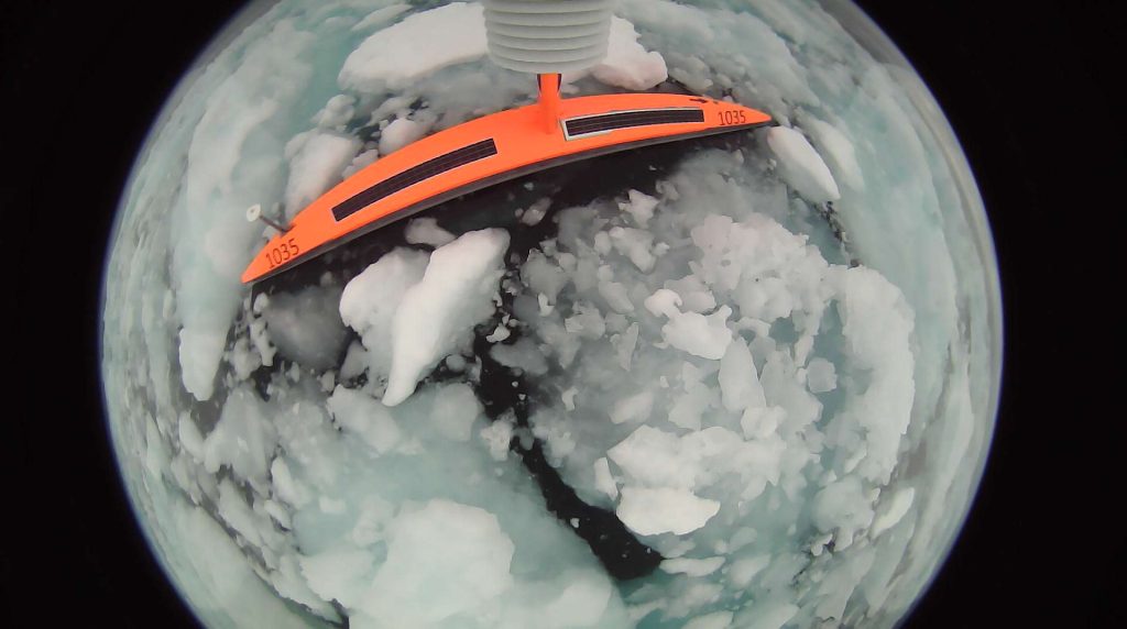 A saildrone surrounded by sea ice