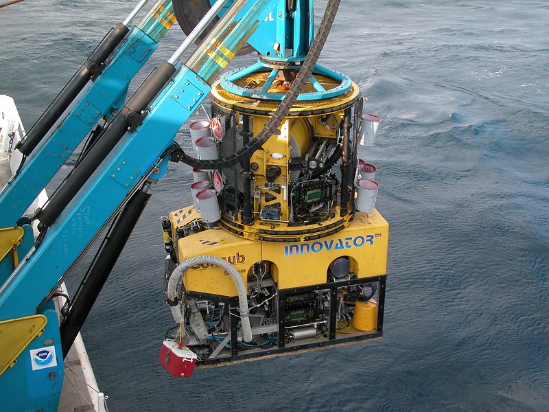 The tether management system sits on top of this ROV during deployment and recovery of ROV. It is suspended by the support vessel above the ocean floor during dives. It manages the tether line for the ROV as it moves down to the ocean floor, ensuring that it doesn't drag along the bottom, and is also used fo r sample storage as can be seen by the various baskets hanging from the frame. Gulf of Mexico. 2003 September 23.