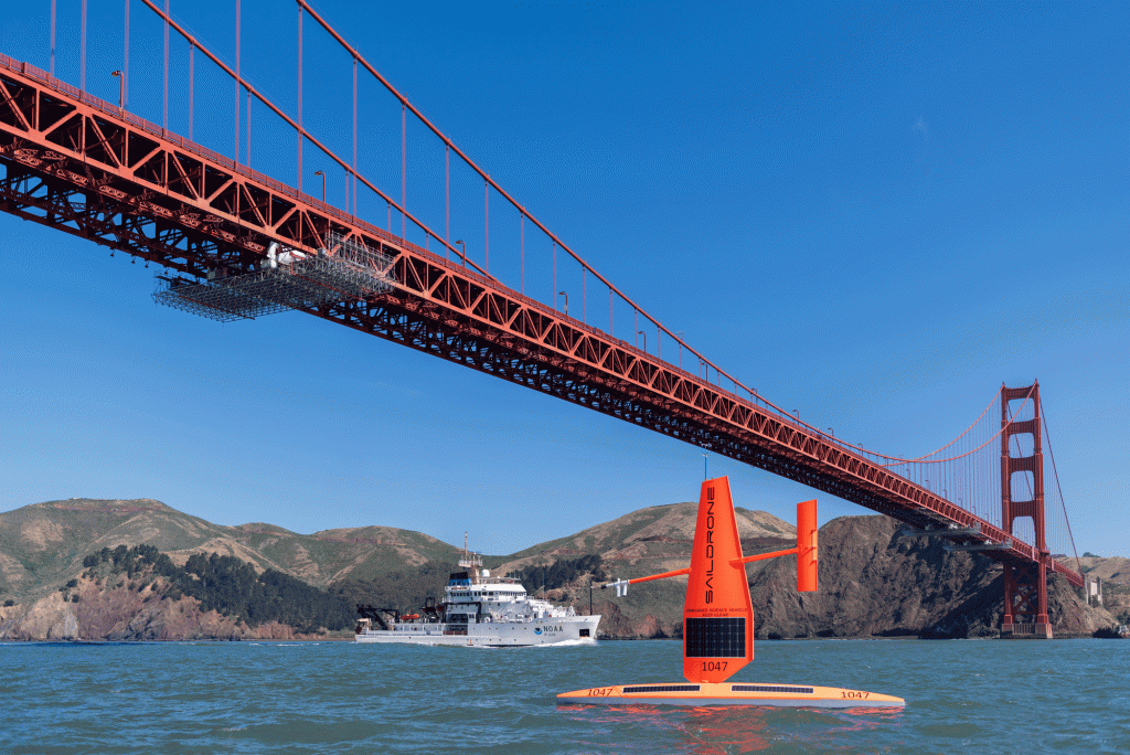 orange drone sailboat under Golden Gate Bridge