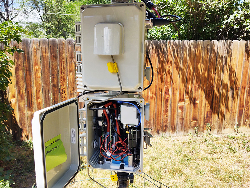 Photo of air monitoring device in a yard.